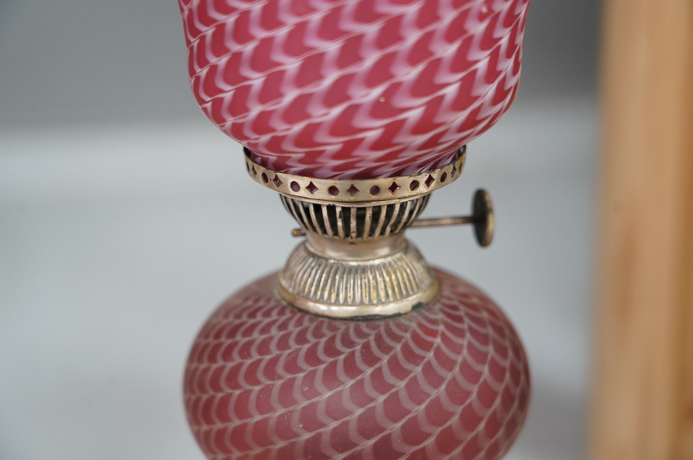 A pair of electroplate and ruby glass oil lamps, 35cm. Condition - good, not tested as working